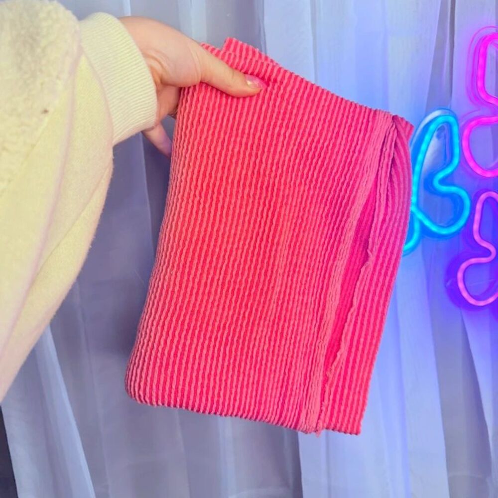 One yard of pink ribbed fabric
